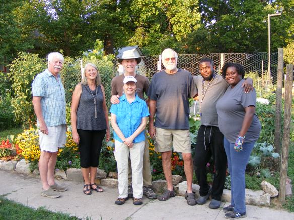 Garden board, leaders and volunteers stand in front of the St. Joseph St. Garden in 2021